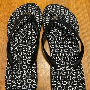 Black and white guess flip flops